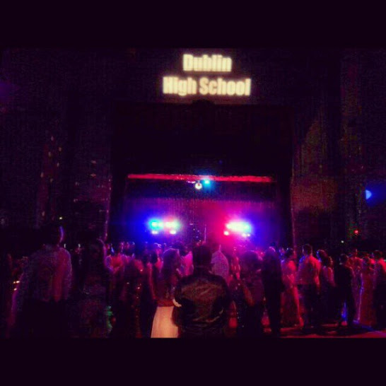 Students gather on the dance floor with lights flashing and music blasting