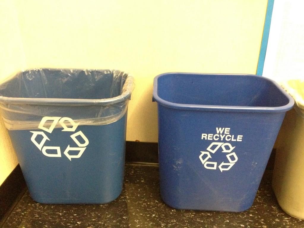 ABOVE: Recycling trash cans are emptied by volunteers after school