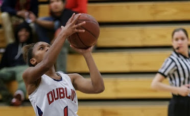 ABOVE: Dublin High Varsity Lady Gael, Milan Moses, goes up for a floater during the game.