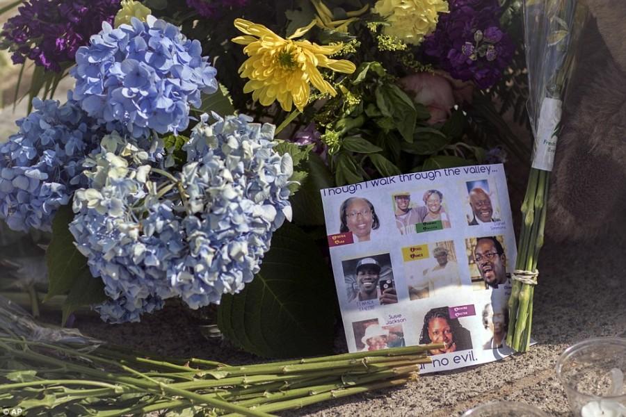 ABOVE: Flowers left for the victims of the Charleston Shooting.
CREDIT: Daily Mail/AP Images
SOURCE:  http://www.dailymail.co.uk/news/article-3131874/Repent-Relatives-Charleston-killer-s-victims-confront-court-heart-wrenching-speeches-FORGIVENESS-adopts-vacant-remorseless-stare.html#v-4308418814001