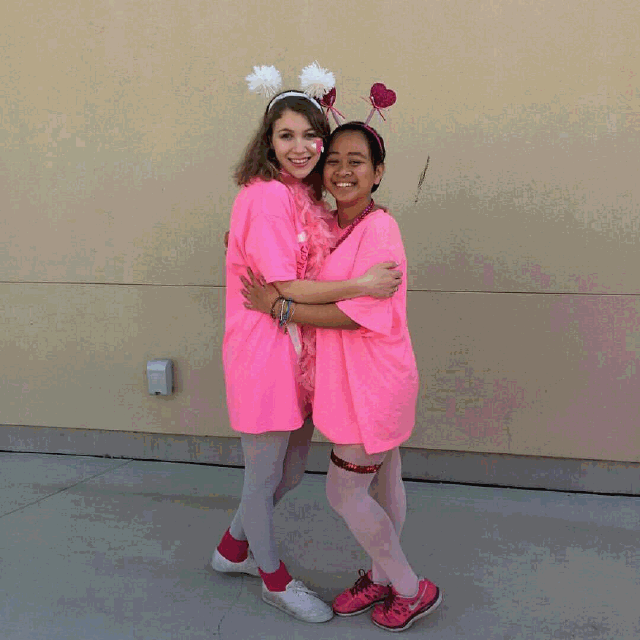 Senior Shannon Greenhouse and Junior Karah Pedregosa hugging outside the choir building on Valentines Day.