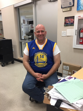 Mr. Everts shows the front of his jersey, a gift from the orchestra.