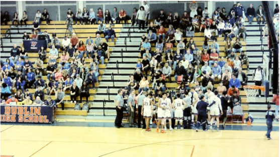 Students at a basketball game. 