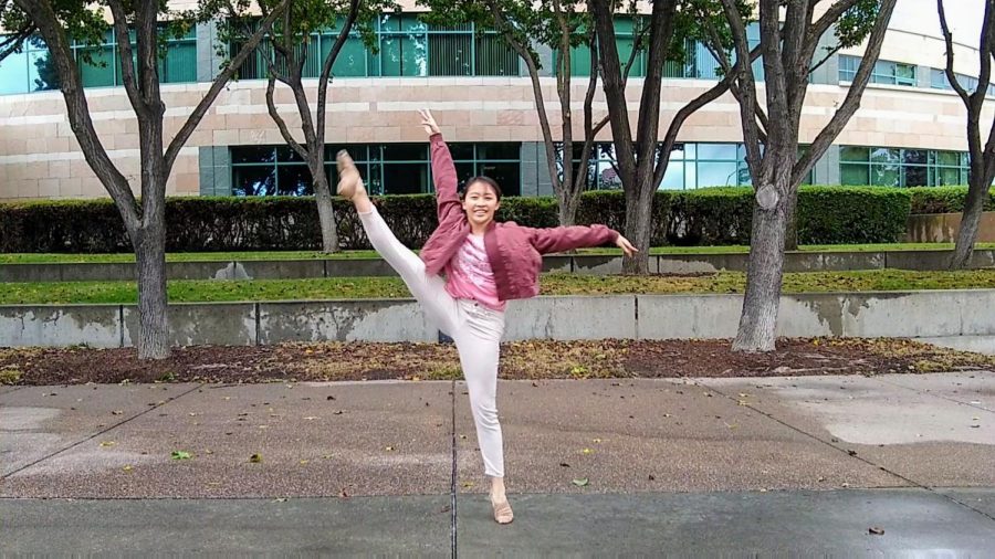 Vivian Tseng performs her dance in front of the Civic Center.