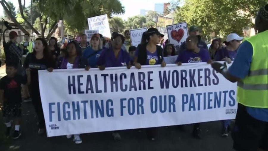 Hospital staff and protestors held up signs in response to staff shortages at Kaiser Permanente Hospital of San Francisco on Oct. 19, 2021. 