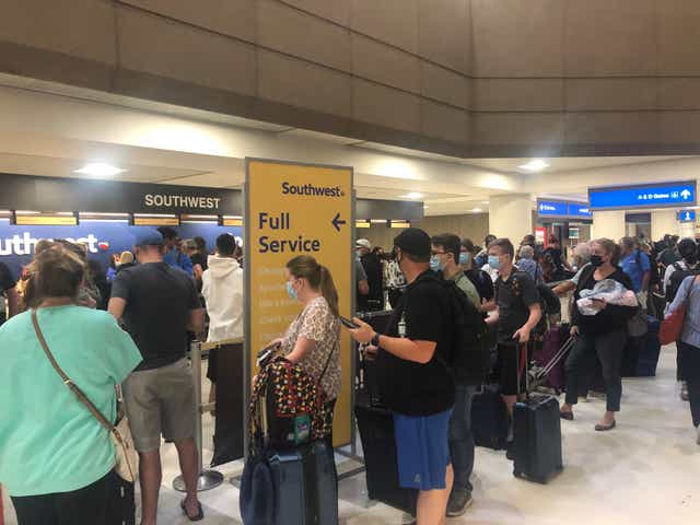 Travelers in check-in lines at the airport