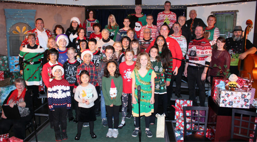 The+Broadway+Chorus+gathers+in+their+Christmas+attire+on+a+Thursday+evening+for+rehearsal+%28East+Bay+Musical+Society%29.+