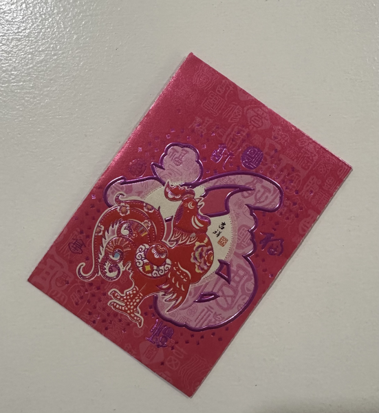 A red envelope that is gifted to family members during Chinese New Year.