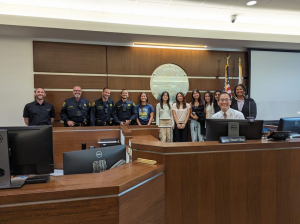 The DHS Pre-Law Society on a field trip to the East County Courthouse, posing for a photo with those who work there.