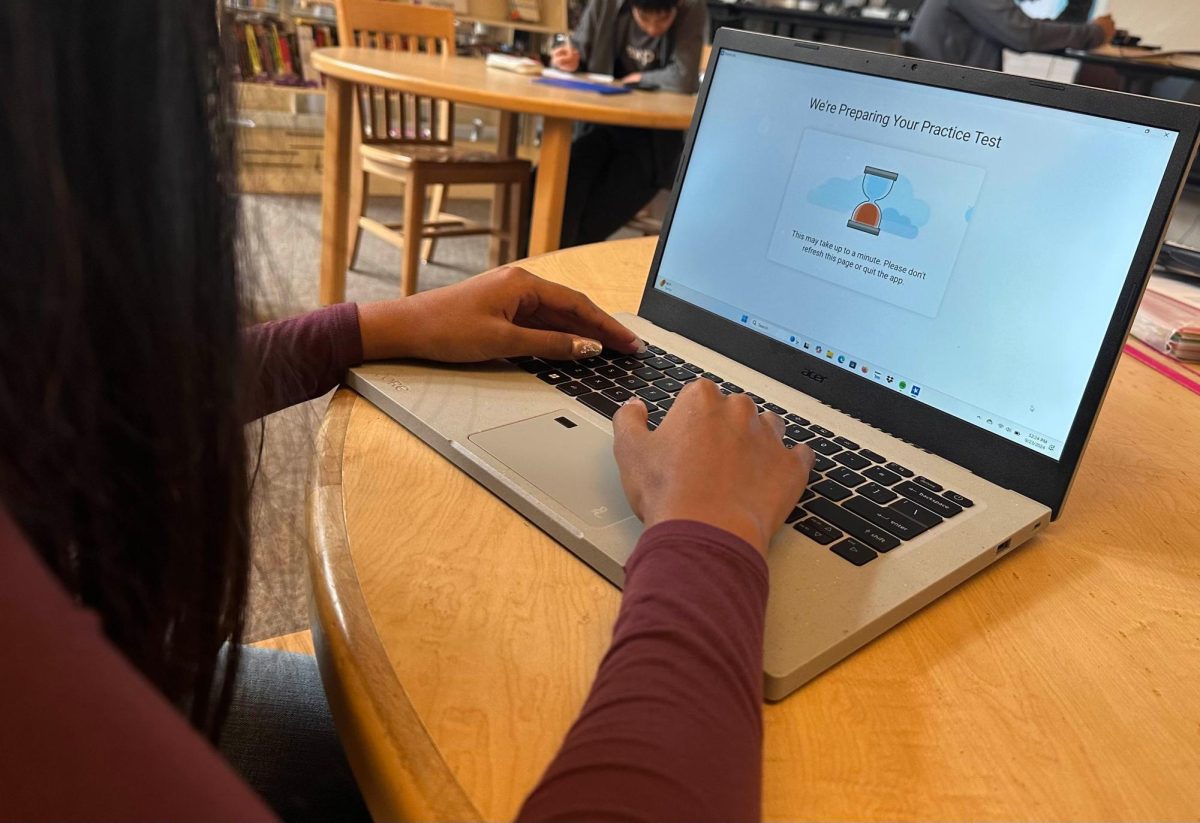 Dublin High student takes a practice Digital SAT test in the library